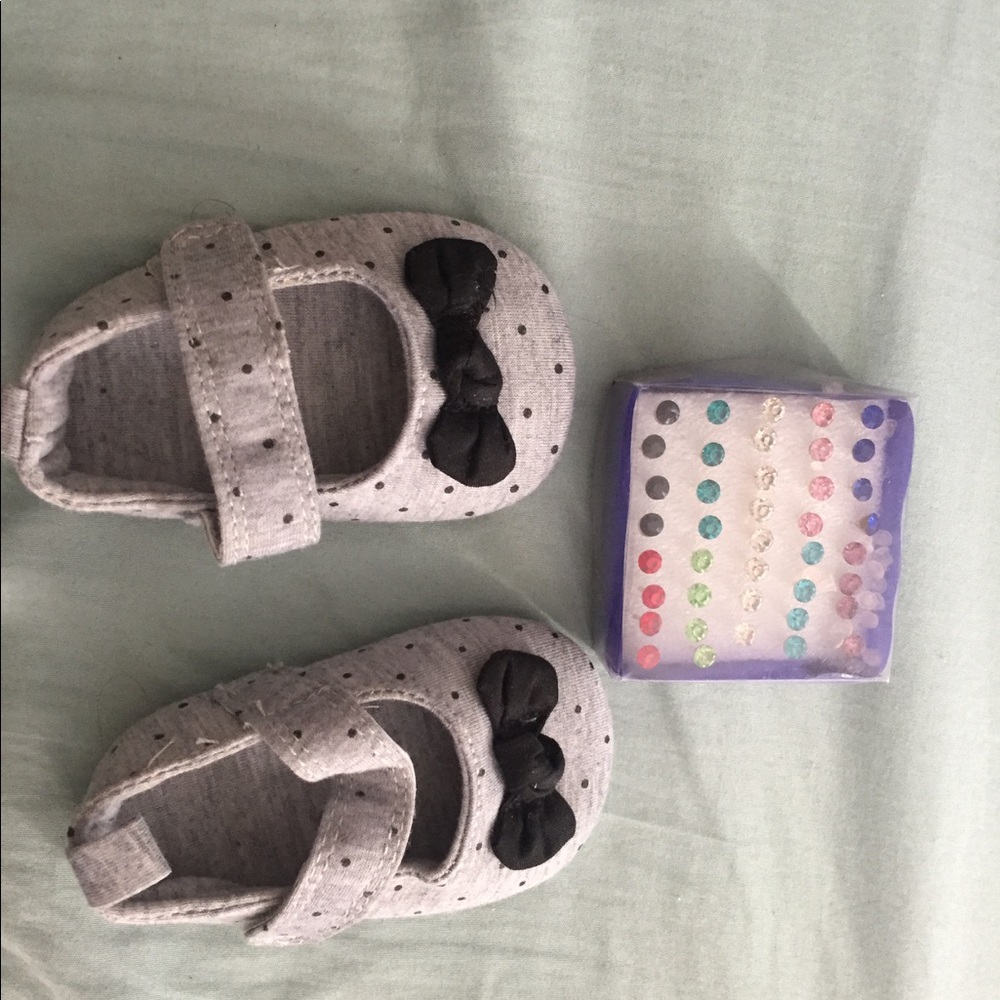 Earrings and baby shoes